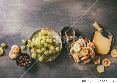 Cheese and grapes appetizer 46854113