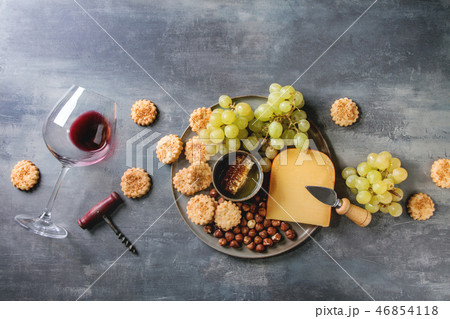 Cheese and grapes appetizer Cheese and grapes appetizer 46854118