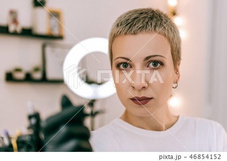 Expressive young tattoo master having workday in salon 46854152