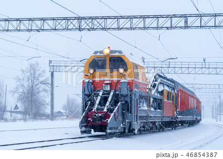 railway snow machine at station during snowfall 46854387