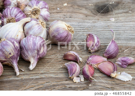 Garlic cloves on wooden vintage background.  46855842