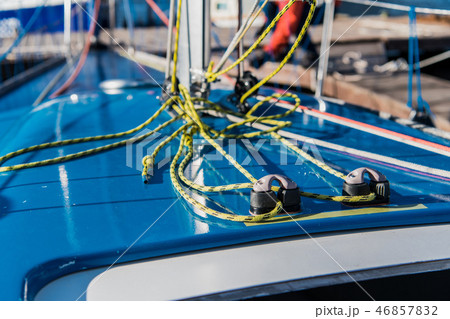 Close-up nautical knot rope tied around stake on boat or ship, boat mooring rope. Close-up nautical knot rope tied around stake on boat or ship, boat mooring rope. 46857832