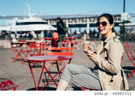 Young woman enjoying coffee sitting cafe outdoors 46862551