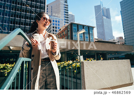 female student holding coffee cup enjoy sunshine female student holding coffee cup enjoy sunshine 46862569