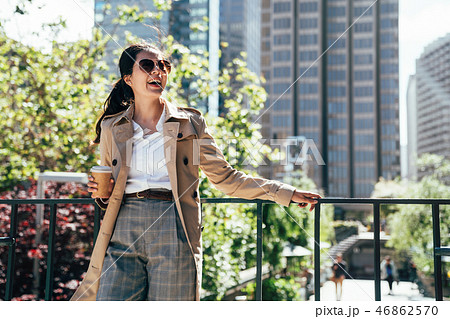 asian businesswoman drinking coffee outdoor asian businesswoman drinking coffee outdoor 46862570