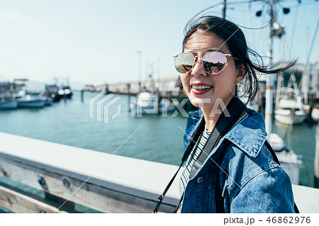 happy lady smiling face camera wearing sunglasses 46862976