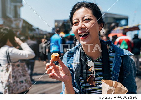 happy woman tasty street food in san francisco 46862998