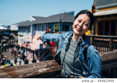 Joyful woman pointing fingers to down stairs 46862999