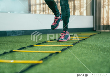 unrecognized athlete practicing for hurdle run unrecognized athlete practicing for hurdle run 46863902