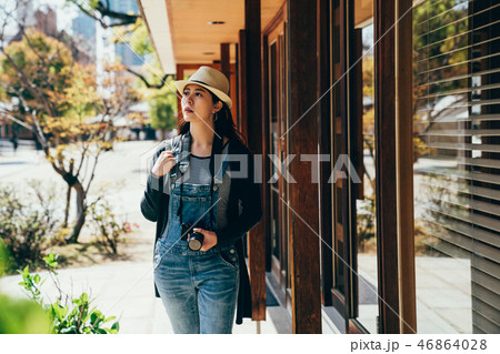 tourist walking pass by window under the shadow 46864028