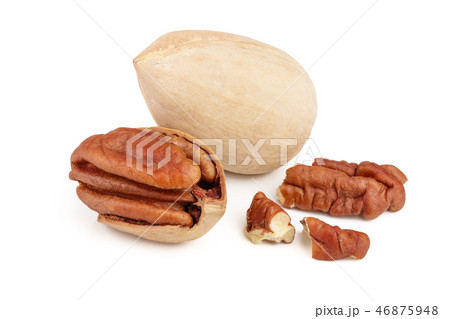 Three pecan nuts isolated on white background Three pecan nuts isolated on white background 46875948