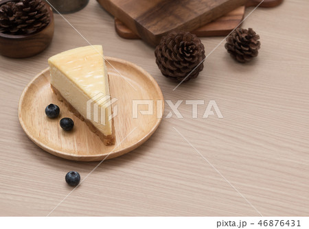 lemon cheesecake on wooden background lemon cheesecake on wooden background 46876431