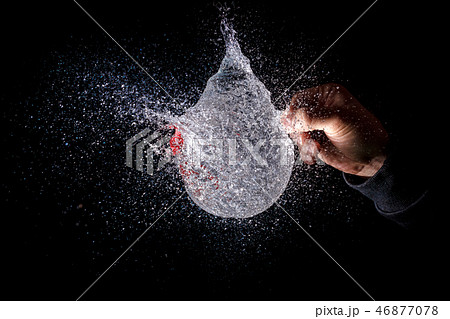 amazing explosion of isolated water balloon amazing explosion of isolated water balloon 46877078