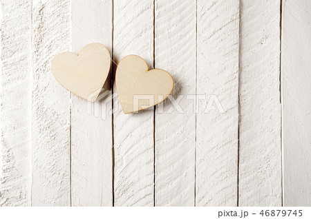 Two wood heart on a vintage wooden background. 46879745