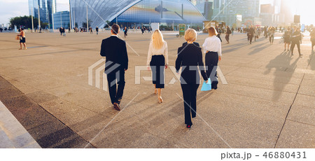 Business persons walking outside in  . 46880431