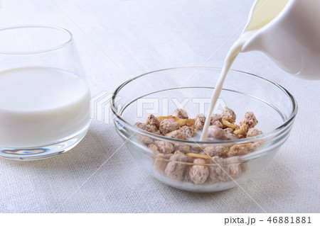 Healthy food with Corn Flakes cereal in a bowl, apple, banana and glass with milk. Morning breakfast Healthy food with Corn Flakes cereal in a bowl, apple, banana and glass with milk. Morning breakfast 46881881