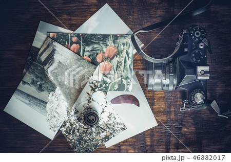 Old photo film roll and retro camera on desk 46882017