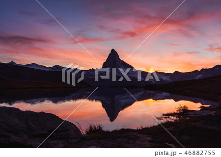 Incredible colorful sunset on Stellisee lake Incredible colorful sunset on Stellisee lake 46882755