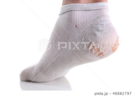Ripped white sock on male leg isolated 46882797