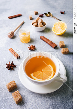 Cup of tea with lemon and brown sugar, cinnamon  46883692
