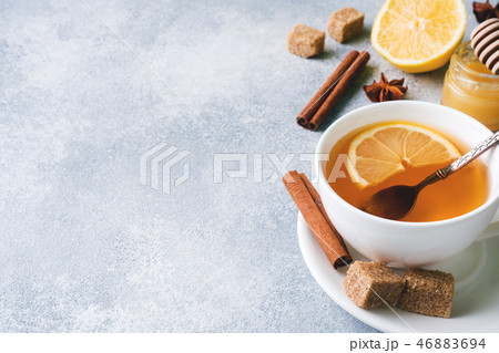 Cup of tea with lemon and brown sugar, cinnamon Cup of tea with lemon and brown sugar, cinnamon 46883694