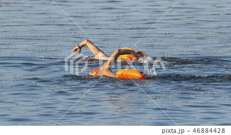 Two male swimmers training together outdoors 46884428
