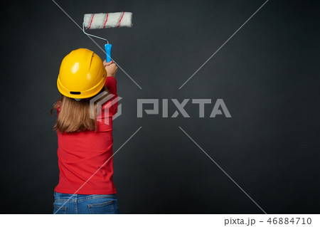 Decoration, renovation and reconstrucion concept. Painting girl Decoration, renovation and reconstrucion concept. Painting girl 46884710