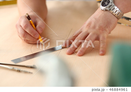 Arms of worker making structure plan 46884961