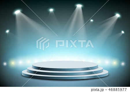 Spotlights illuminates a round stage. 46885977