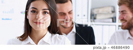 Beautiful smiling cheerful girl at workplace Beautiful smiling cheerful girl at workplace 46886490