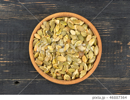 Pumpkin seed kernels in bowl Pumpkin seed kernels in bowl 46887364