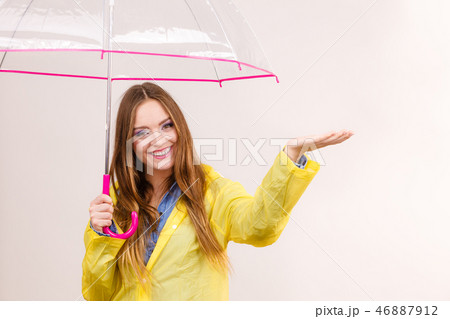 Woman in rainproof coat with umbrella. Forecasting Woman in rainproof coat with umbrella. Forecasting 46887912