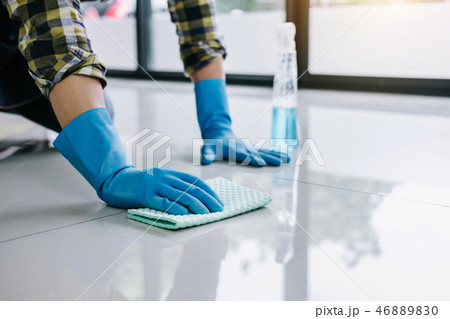 Husband housekeeping and cleaning concept, Happy young man in bl 46889830