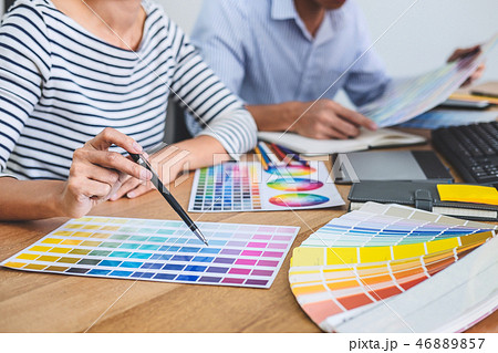 Two colleagues creative graphic designer working on color select 46889857