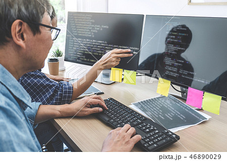 Two professional programmers cooperating at...の写真素材 [46890029] - PIXTA
