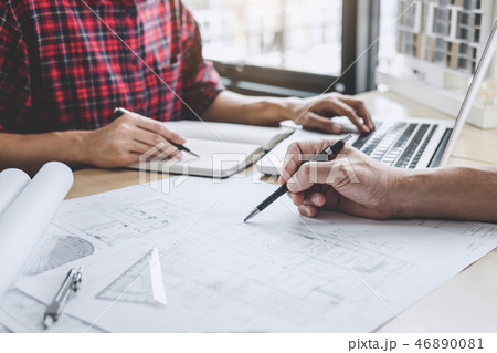 Hands of architect or engineer working on blueprint meeting for Hands of architect or engineer working on blueprint meeting for 46890081