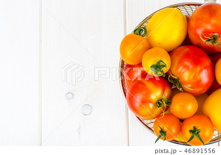 Different in color and size of tomatoes 46891556