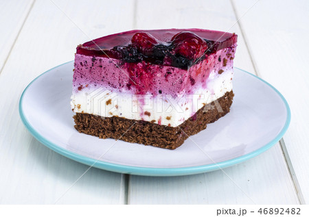 Piece of cake with berries and jelly Piece of cake with berries and jelly 46892482