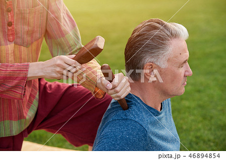 Thai massage by wood hammer for treat. Thai massage by wood hammer for treat. 46894854