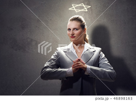 Praying businesswoman 46898163