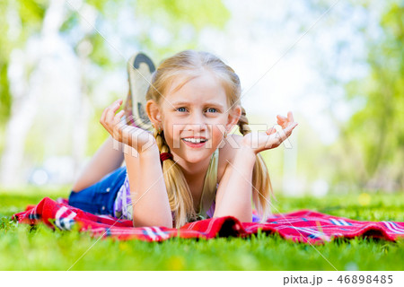 portrait of a smiling girl in a park 46898485