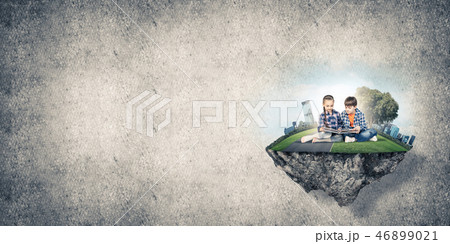 Two kids of school age with book exploring this great world Two kids of school age with book exploring this great world 46899021
