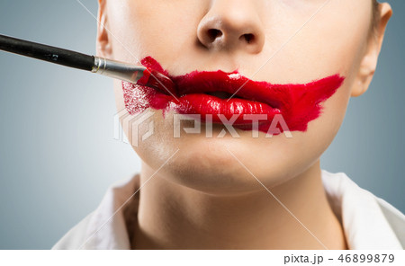 close-up vivid red mouth 46899879