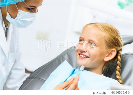Dentist inspecting patient Dentist inspecting patient 46900149