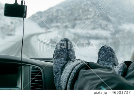 human feet on the background of glass in the car 46903737