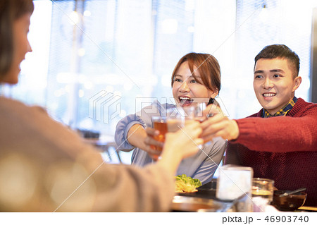 happy young people friends toasting and eating in the restaurant 46903740