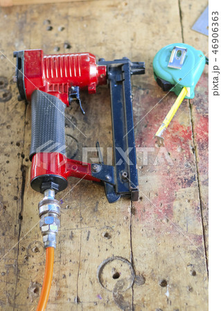 Carpenters are using tools with wood . 46906363