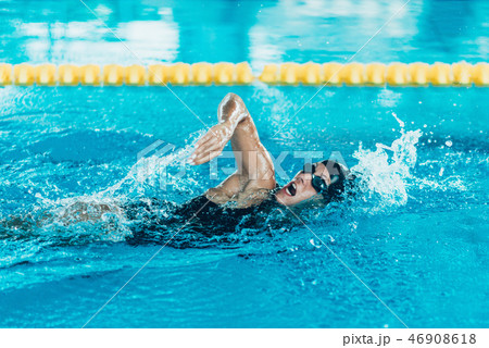 Front crawl swimmer in the pool 46908618