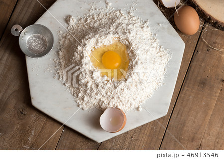 eggs on flour with copy space 46913546