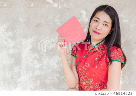 asian woman wearing red traditional dress holding  46914522